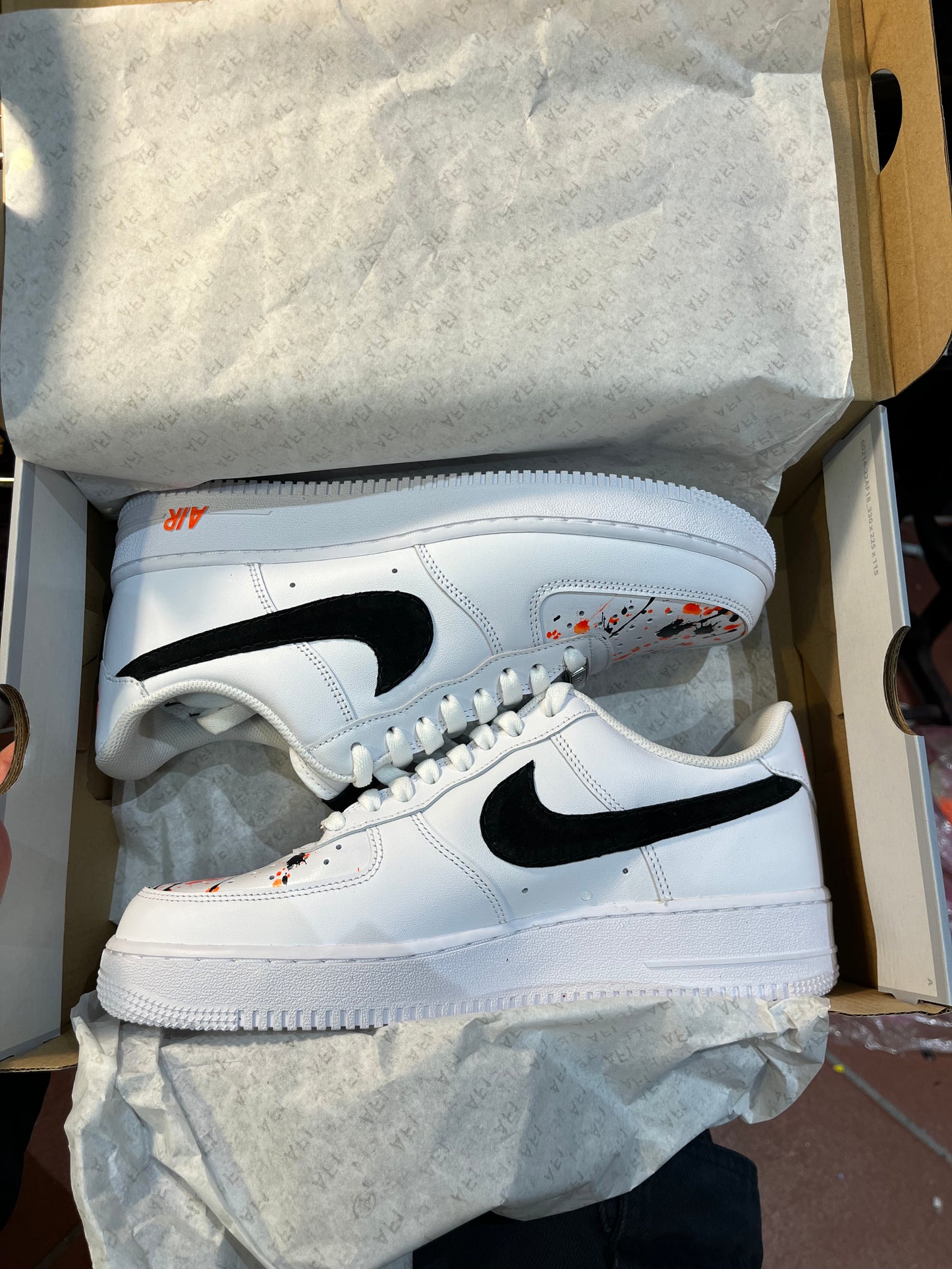 Black suede swoosh + splatter